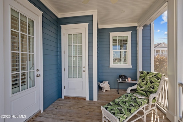 view of exterior entry with a porch