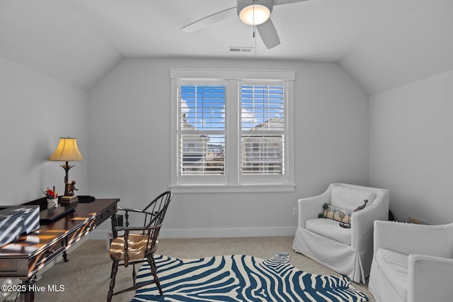 carpeted home office with ceiling fan and vaulted ceiling