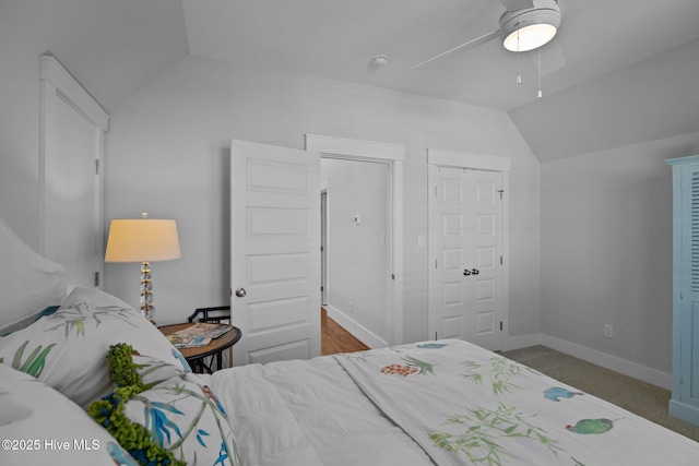 carpeted bedroom featuring ceiling fan and lofted ceiling