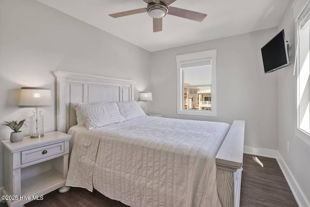 bedroom featuring dark wood-type flooring and ceiling fan