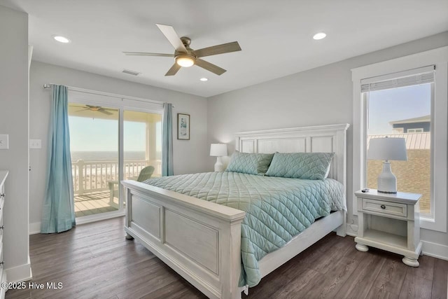 bedroom with access to outside, dark wood-type flooring, ceiling fan, and multiple windows