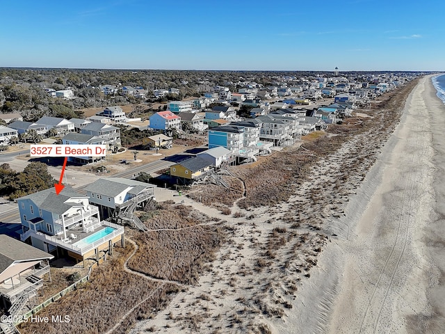 bird's eye view featuring a view of the beach