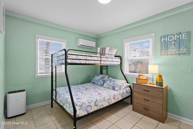 bedroom featuring light tile patterned flooring, multiple windows, and a wall mounted AC