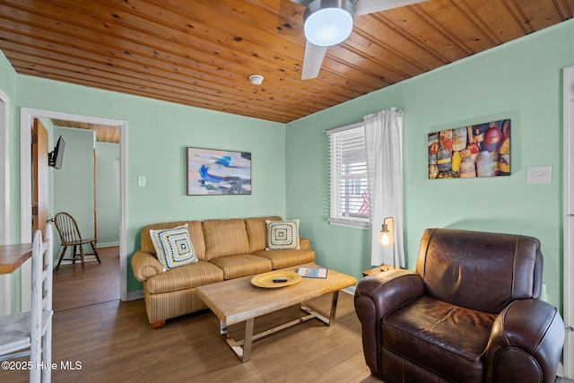 living room featuring hardwood / wood-style floors, ceiling fan, and wood ceiling