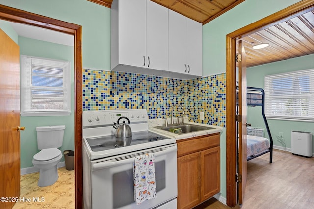 kitchen with white cabinets, white electric range, sink, decorative backsplash, and wood ceiling