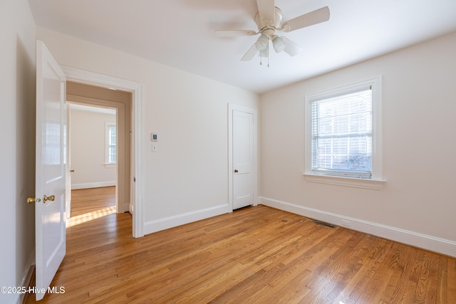 unfurnished room with ceiling fan and light hardwood / wood-style flooring