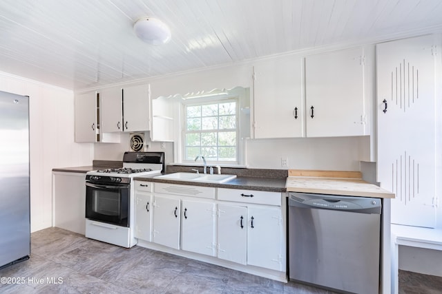 kitchen with stainless steel appliances, crown molding, white cabinetry, and sink