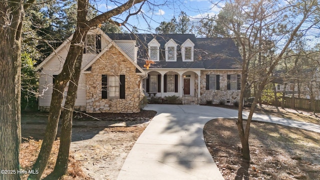 new england style home with covered porch