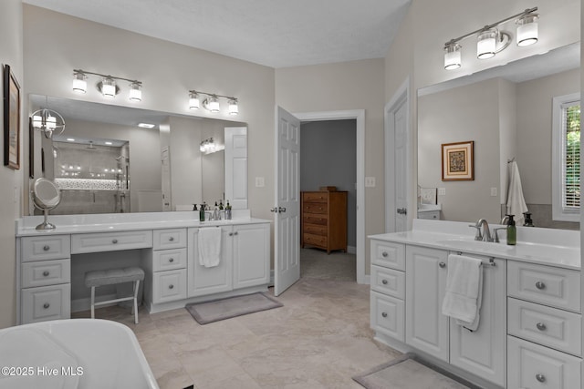 bathroom with vanity, independent shower and bath, and a textured ceiling