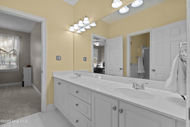 bathroom featuring vanity and ceiling fan