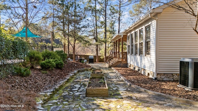 view of yard featuring central AC unit