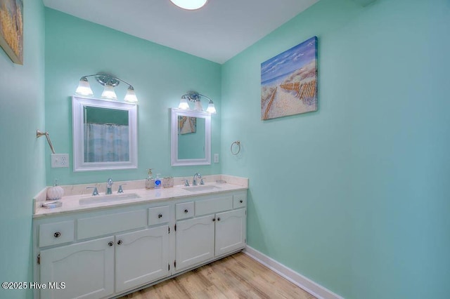 bathroom featuring vanity and hardwood / wood-style flooring