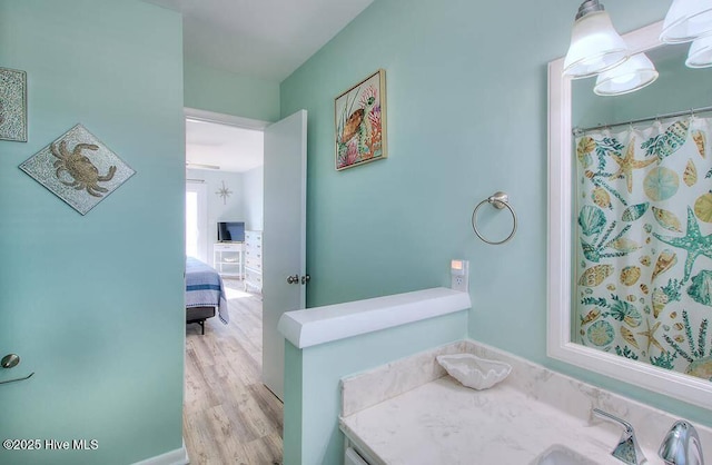 bathroom featuring vanity and hardwood / wood-style floors