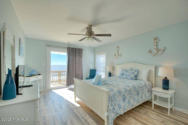 bedroom with light hardwood / wood-style floors, ceiling fan, and access to outside