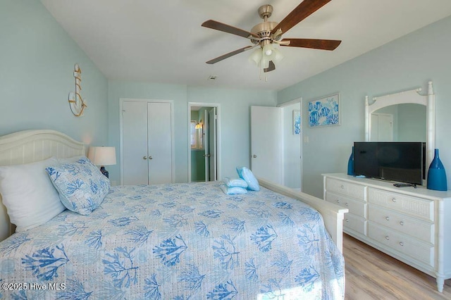 bedroom featuring ceiling fan and light hardwood / wood-style flooring