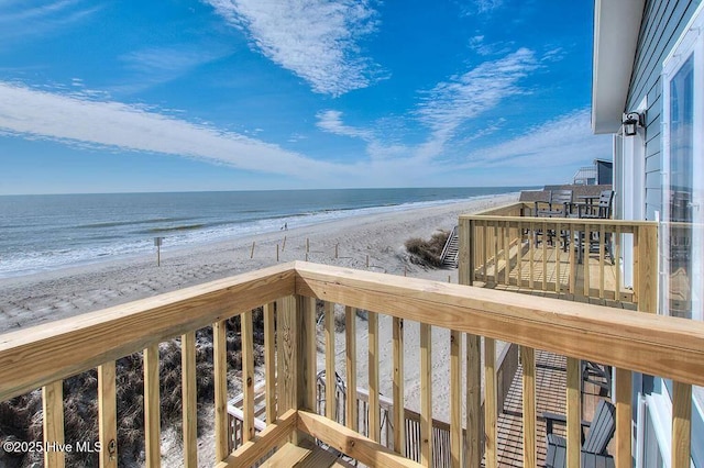 exterior space with a water view and a view of the beach