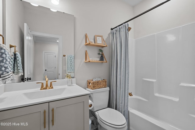 full bathroom featuring vanity, toilet, and shower / bathtub combination with curtain