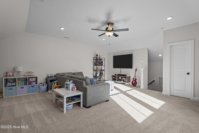 living room featuring ceiling fan, light colored carpet, and lofted ceiling