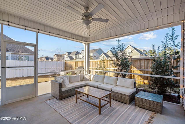 sunroom / solarium with ceiling fan