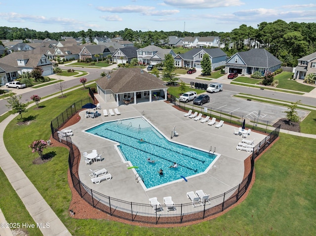 view of pool featuring a yard