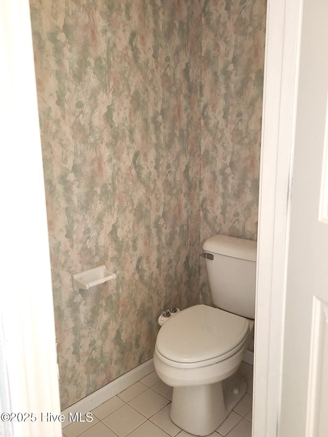 bathroom with tile patterned floors and toilet