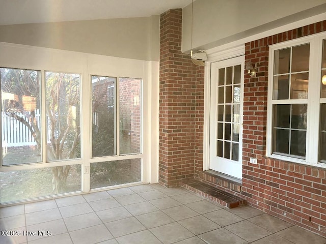 unfurnished sunroom with vaulted ceiling