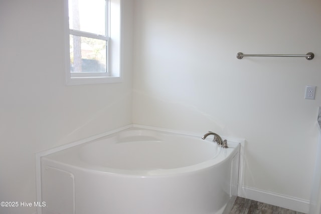 bathroom with a tub