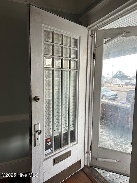 doorway to outside featuring dark hardwood / wood-style floors