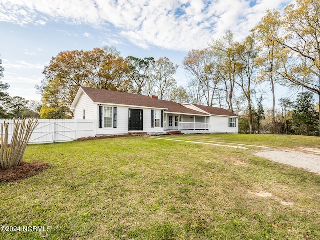 view of front of property with a porch and a front yard