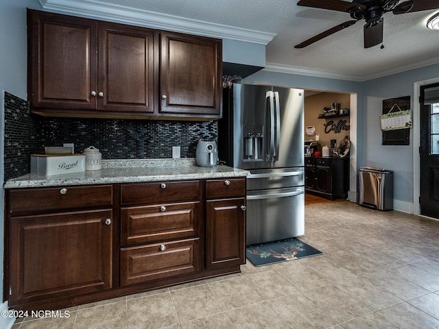 kitchen with stainless steel refrigerator with ice dispenser, dark brown cabinets, crown molding, and ceiling fan