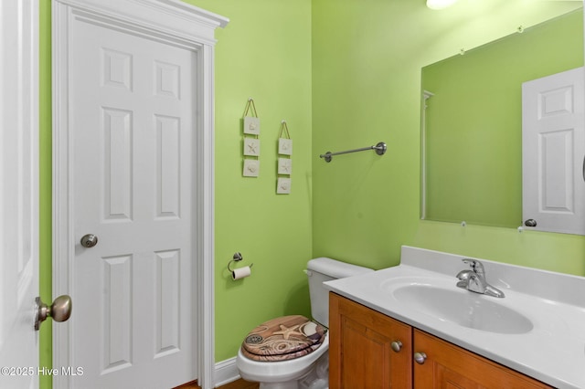 390 E Second St, Ocean Isle Beach, NC 28469 - bathroom featuring vanity and toilet