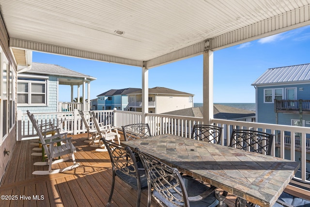 wooden terrace with outdoor dining area