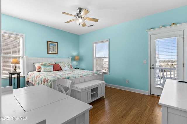 bedroom with ceiling fan, access to exterior, visible vents, wood finished floors, and baseboards