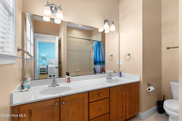 390 E Second St, Ocean Isle Beach, NC 28469 - full bathroom with toilet, double vanity, tile patterned flooring, and curtained shower