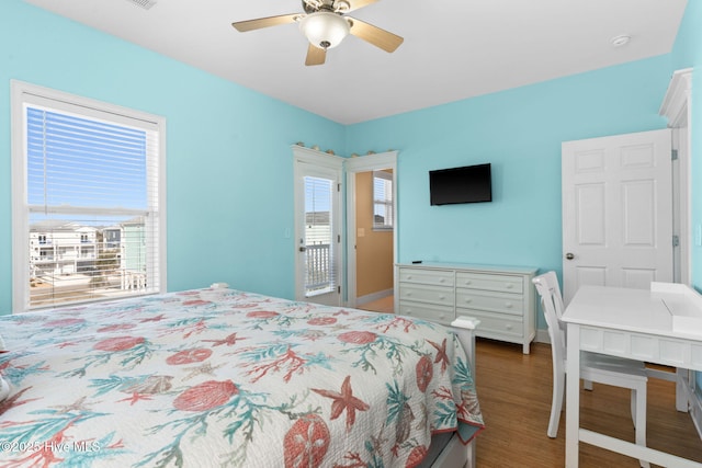 bedroom with baseboards, a ceiling fan, and wood finished floors