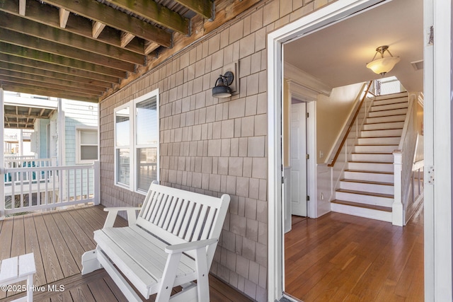 wooden deck featuring stairs