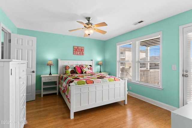 390 E Second St, Ocean Isle Beach, NC 28469 - bedroom with light wood-type flooring, baseboards, and a ceiling fan