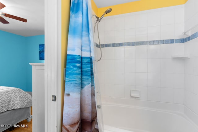 bathroom with shower / bath combo and a ceiling fan