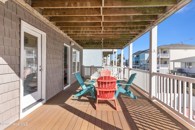 wooden terrace with a residential view