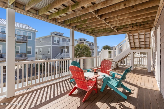 wooden deck featuring a residential view and stairway