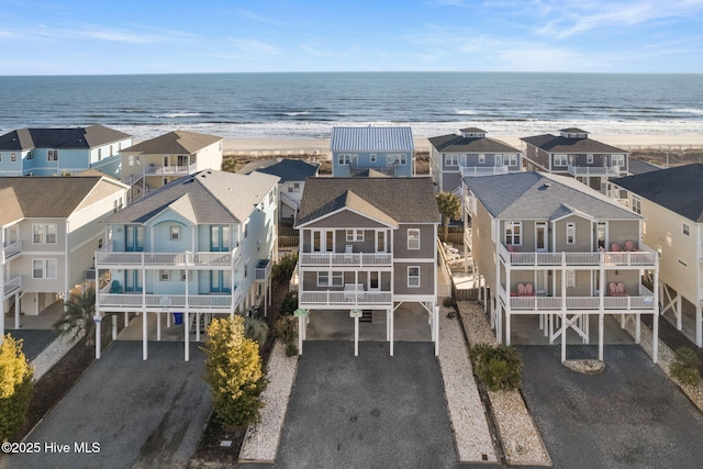 birds eye view of property featuring a water view and a residential view