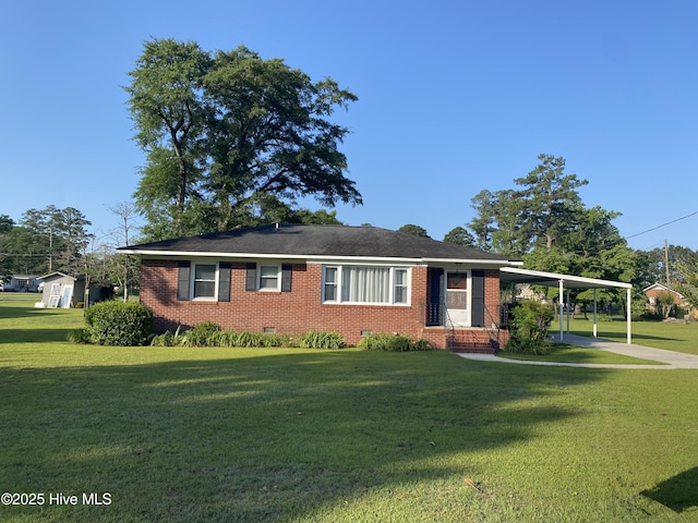 405 Pollock St, Pollocksville, NC 28573 - ranch-style home featuring brick siding, crawl space, a front lawn, a carport, and concrete driveway