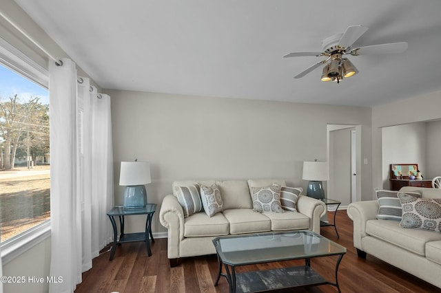 living room with dark hardwood / wood-style floors and ceiling fan