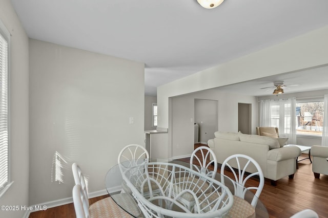 dining space featuring hardwood / wood-style flooring and ceiling fan