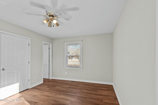 unfurnished bedroom featuring wood-type flooring and ceiling fan