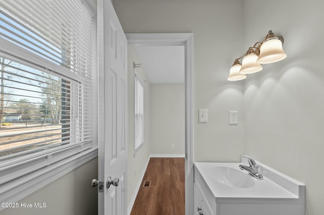 bathroom with vanity and hardwood / wood-style floors