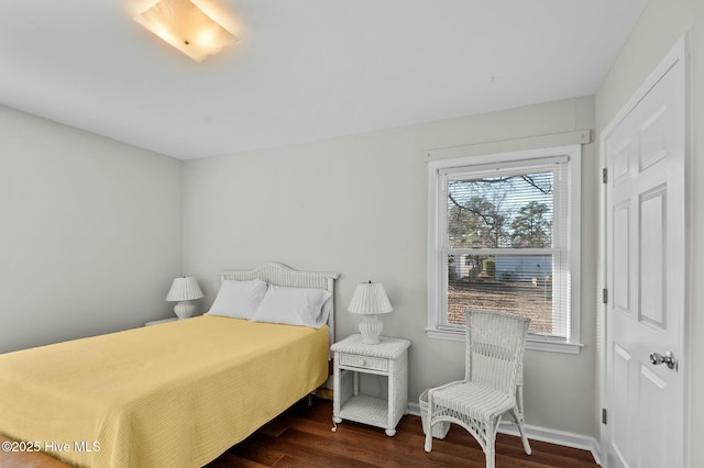 bedroom featuring dark wood-type flooring