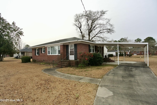 single story home with a carport