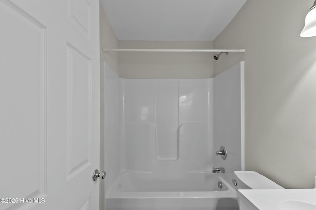 full bathroom featuring shower / washtub combination, vanity, and toilet