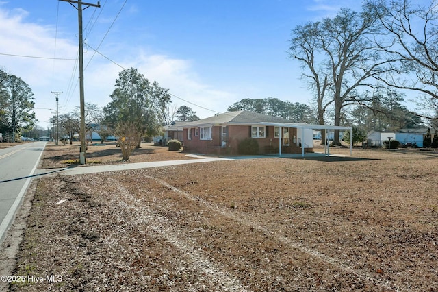 view of front of property with a carport